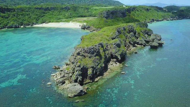 Beach and cliffs on coast, Kafu Banta, Miyagi Island, Japan