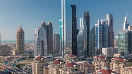Aerial view of skyscrapers and road junction in Dubai timelapse