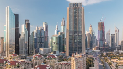 Aerial view on downtown and financial district in Dubai timelapse, United Arab Emirates with skyscrapers and highways.