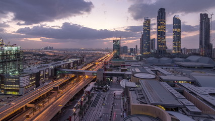 Aerial view of Financial center road night to day timelapse with under construction building