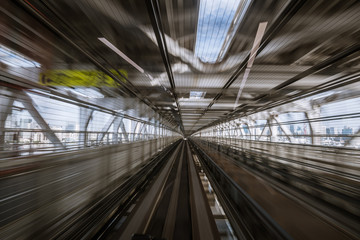 motion-blurred view from a moving train running in tunnel