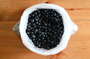 Ripe bilberries in a plastic bag