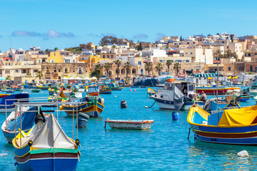 Obraz premium The traditional eyed boats in the harbor of fishing village Marsaxlokk in Malta