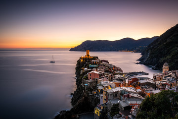 Sunset above the terraces of Vernazza. Vernazza is one of the five towns that make up the Cinque Terre region. It is the only natural port of Cinque Terre and is famous for its elegant houses.