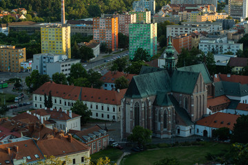 View of the center of Brno Czech Republic houses church and street captured from the height of the walls of Spilberk Castle during sunset in summer time.