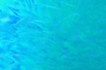 Abstract texture of paint strokes on canvas, background in turquoise color.
