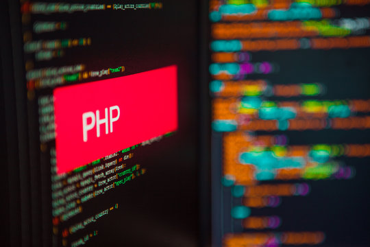 Programming language, PHP inscription on the background of computer code.