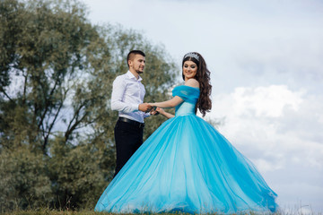 Fototapeta premium Teens dancing in the nature. Couple in love. Romantic first date. Carefree and free youth.
