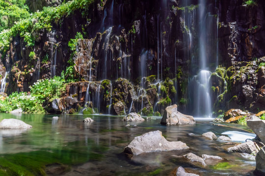 Dashbashi canyon, waterfalls and Khrami river in Tsalka district, Georgia. Beautiful waterfall on a sunny day among the green