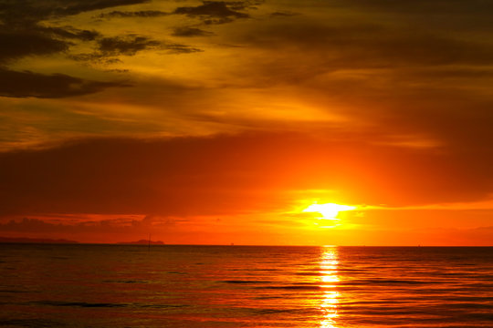 sunset on sea and ocean last light red sky silhouette cloud © darkfoxelixir