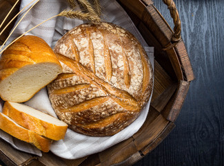 Freshly baked traditional bread on wooden table