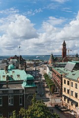 Fototapeta na wymiar Helsinborg, Sweden - August, 2018: View of the city centre and the port of Helsingborg in Sweden. The ship is moored in port in Helsingborg harbour.