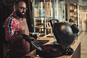 Chef preparing charcoals before grilling in a restaurant