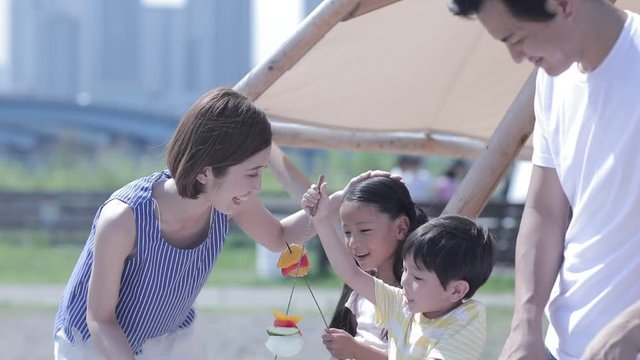 Family having picnic, Koto, Tokyo, Japan