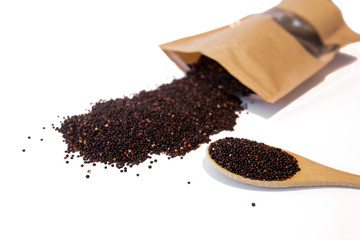 Raw brown seeds quinoa closeup isolated at white background