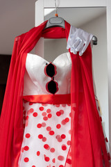 red wedding dress with glasses and white gloves