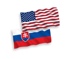 National vector fabric wave flags of Slovakia and USA isolated on white background. 1 to 2 proportion.