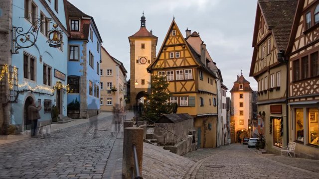 Day to night timelapse of Rothenburg ob der Tauber old town Das Plonlein at Christmas, Bavaria, Germany.