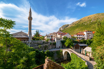 The Bridge Kriva Cuprija and a mosque in Mostar, Bosnia and Herzegovina