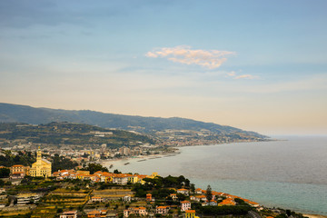 High angle view of the Ponente Riviera with the sea village of Bussana Nuova on Marine Cape and the coastal cities of Arma di Taggia and Santo Stefano Mare in the background, Imperia, Liguria, Italy