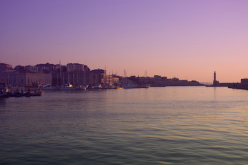 Fototapeta premium Venetian Harbor and lighthouse of Chania Old Town. Crete island of Greece