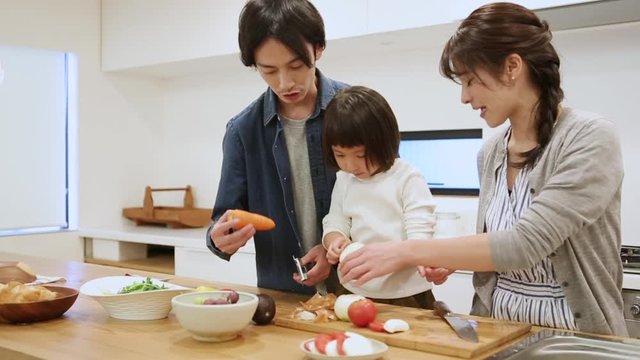 Close up of family preparing healthy food together