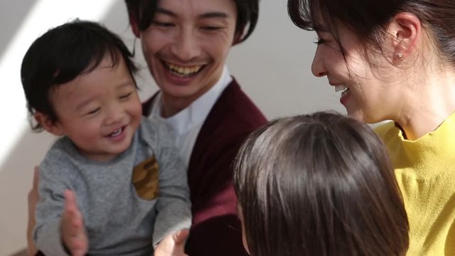Parents playing with children