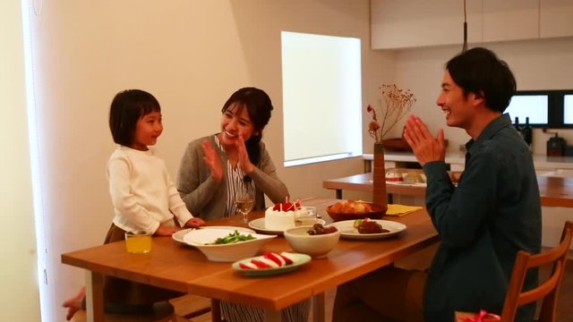 Close up of family celebrating birthday together