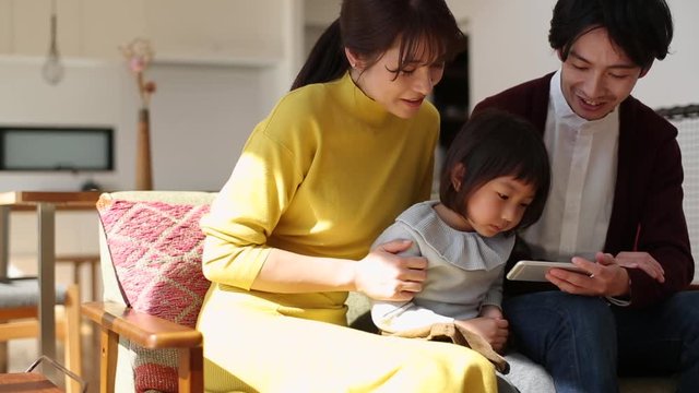 Family watching video on smartphone