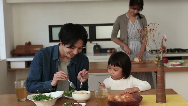 Close&not;&dagger;up of family having healthy dinner