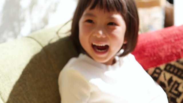 Portrait of little girl counting on fingers