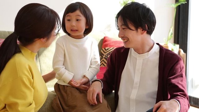Parents playing with little daughter