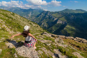 tourist girl with hat . Spectacular view of Montenegro Mountains above THE CIJEVNA CANYON and Grlo...