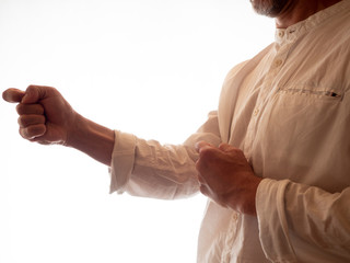 Plakat Human hand training in karate, tai-chi, martial arts. White shirt on white background.