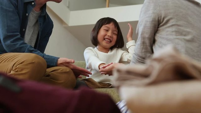 Close up of child playing with parents
