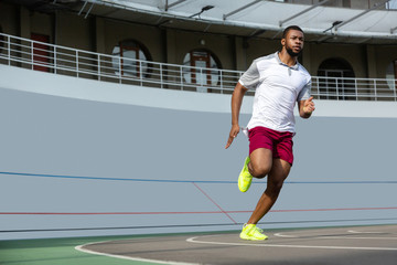 Fototapeta premium Confident handsome male runner jogging in the morning