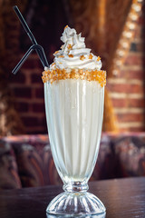 Milkshake on table in cafe close-up