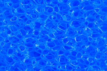 deep blue colored polymeric material with a sponge structure