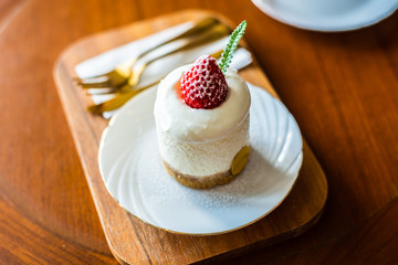 cake with whipped cream and strawberries