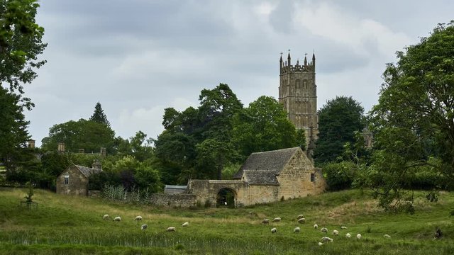 Quintessential English countryside timelapse showing the church tower and farm buildings of Chipping Campden in the Cotswolds. England