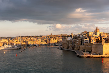 view of the urban landscape and the port of marseille at sunset