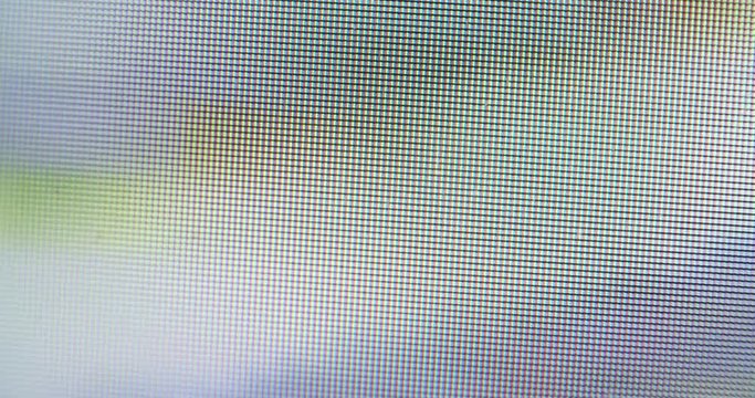 Macro shot of a screen showing moving pictures. Single Pixels visible.