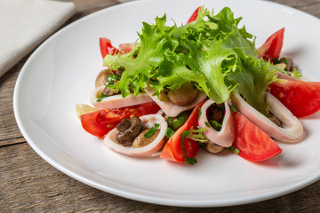 Salad of squid, mushrooms, and vegetables. 