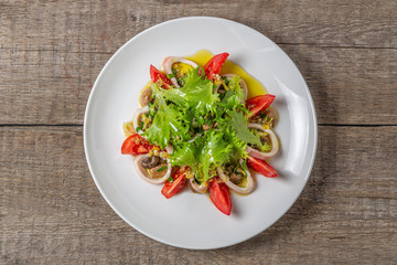 Salad of squid, mushrooms, and vegetables. The view from the top. Copy-space.