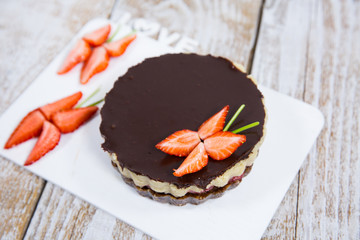 cake with strawberries, nuts and chocolate