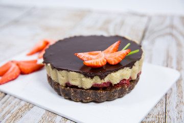 cake with strawberries, nuts and chocolate