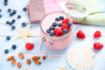 Ice cream with berries, raspberry and blueberry in glass jar