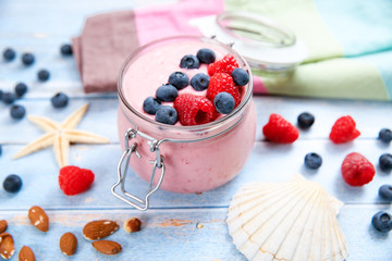 Ice cream with berries, raspberry and blueberry in glass jar