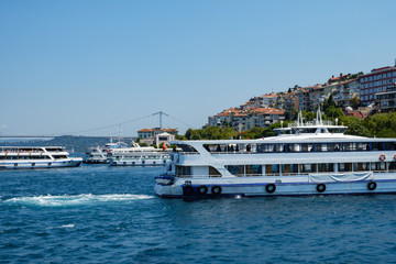 Istanbul, Turkey, Bosphorus Bridge and Uskudar Coast. Pleasure boats sail on the Bosphorus