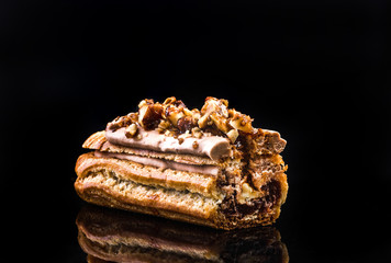 French Artisan Eclair on Black Reflective Background,Copy Space